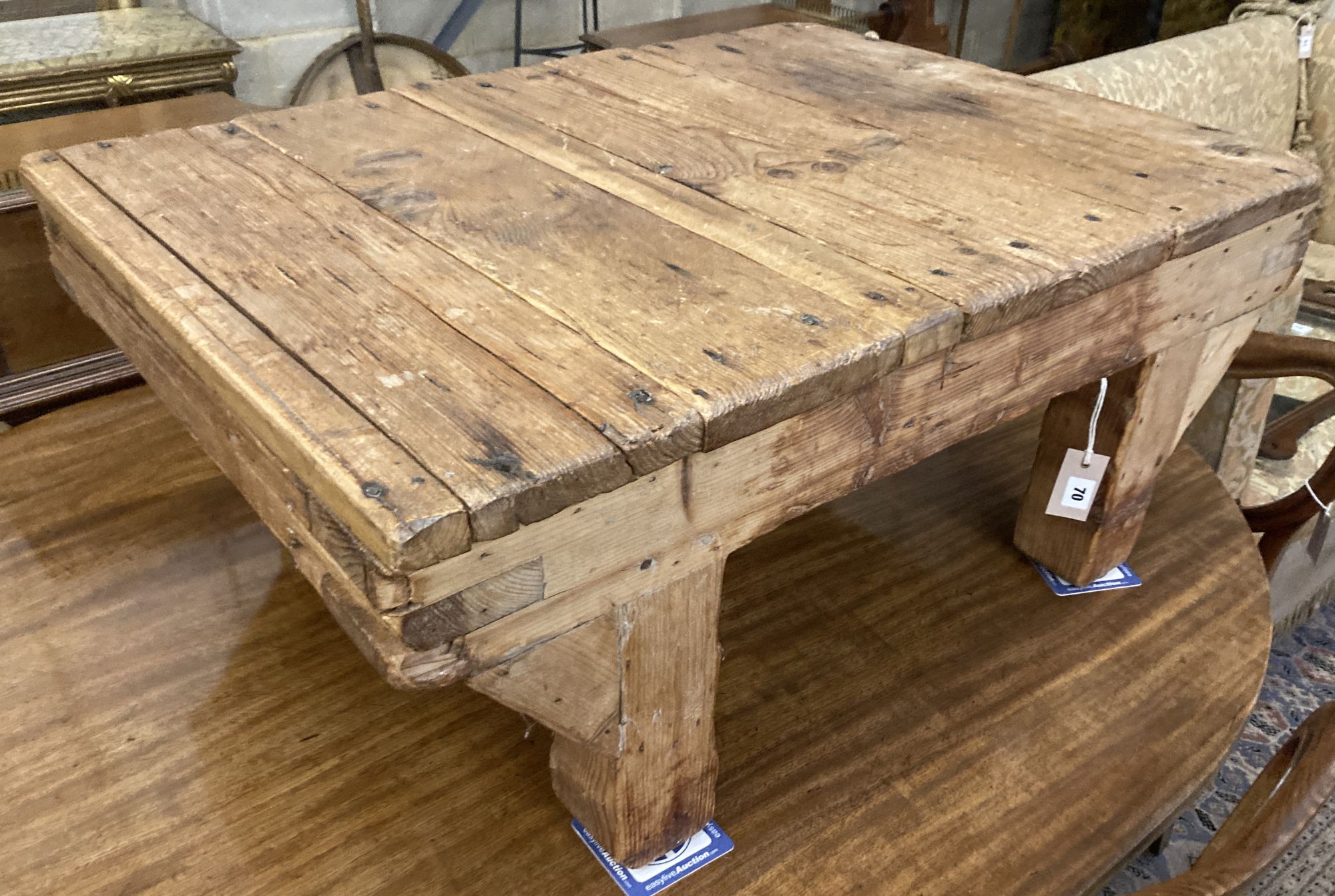 A 19th century provincial pine low dairy table, width 94cm depth 71cm height 39cm